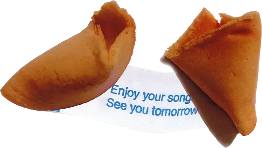 Cracked open fortune cookie with slip